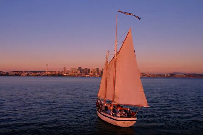 Evening Colors Sunset Sail Tour in Seattle - A drink, a sunset, and the possible cannon salute