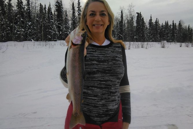 Fairbanks Ice Fishing Expedition in a Heated Cabin with Fish Cookout - Fishing through the floor of a heated cabin
