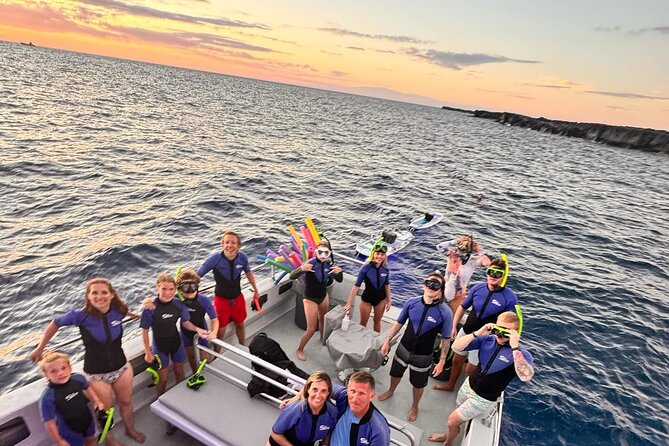 Glow of the Deep: Night Snorkeling with Manta Rays - Getting fitted with wetsuits and flotation gear