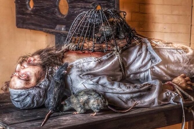 Medieval Torture Museum with Ghost Hunting and Tiny Art Gallery - Using the Audio Guide at Your Own Pace