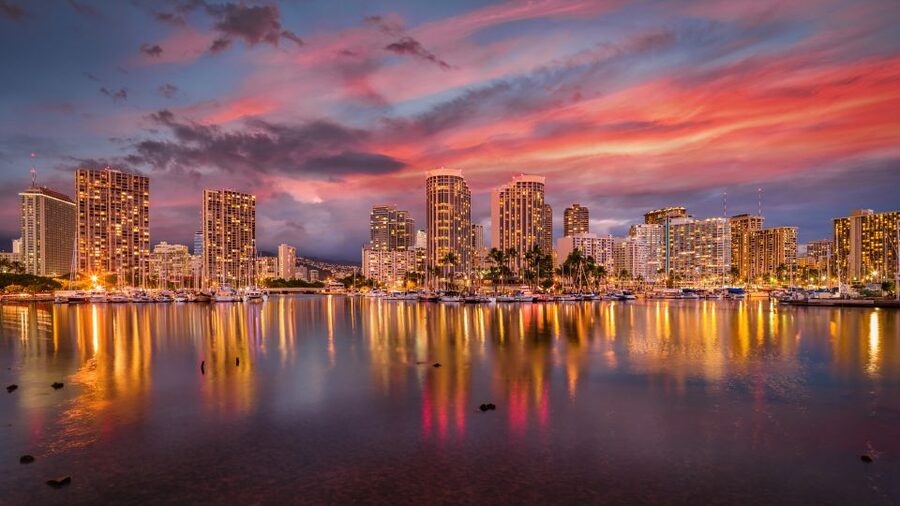 Oahu: Waikiki Glass Bottom Boat Sunset Cruise - Sailing past Waikiki with local stories