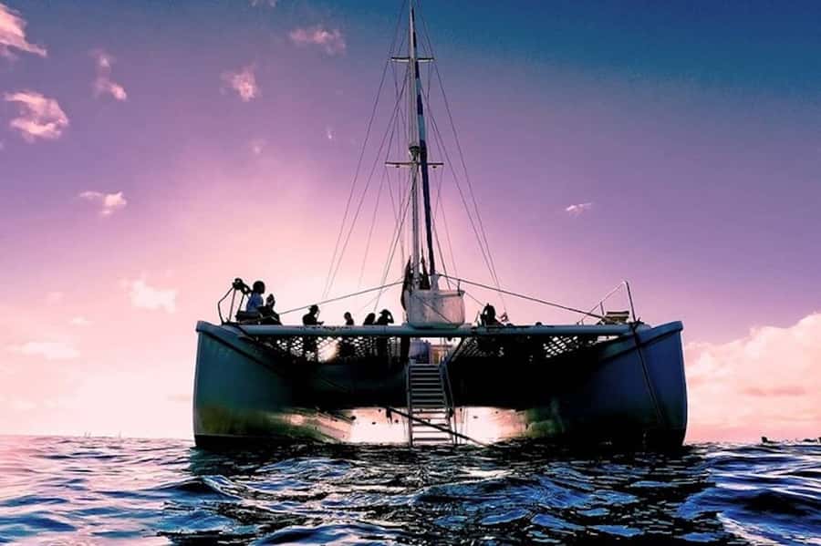 Oahu: Waikiki Sunset Catamaran Sail and Swim - Leaving Waikiki as the sky turns gold