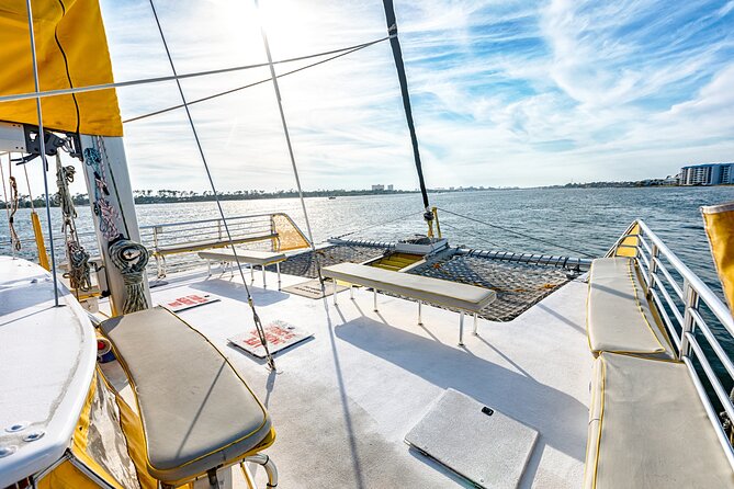 Shell Island Inflatable Adventure Park & Dolphin Sightseeing Tour - Food, drinks, music, and onboard comfort