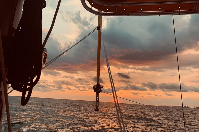 Sunset Dolphin Sail Aboard the Footloose Catamaran - How The Experience Compares With A Beach Sunset